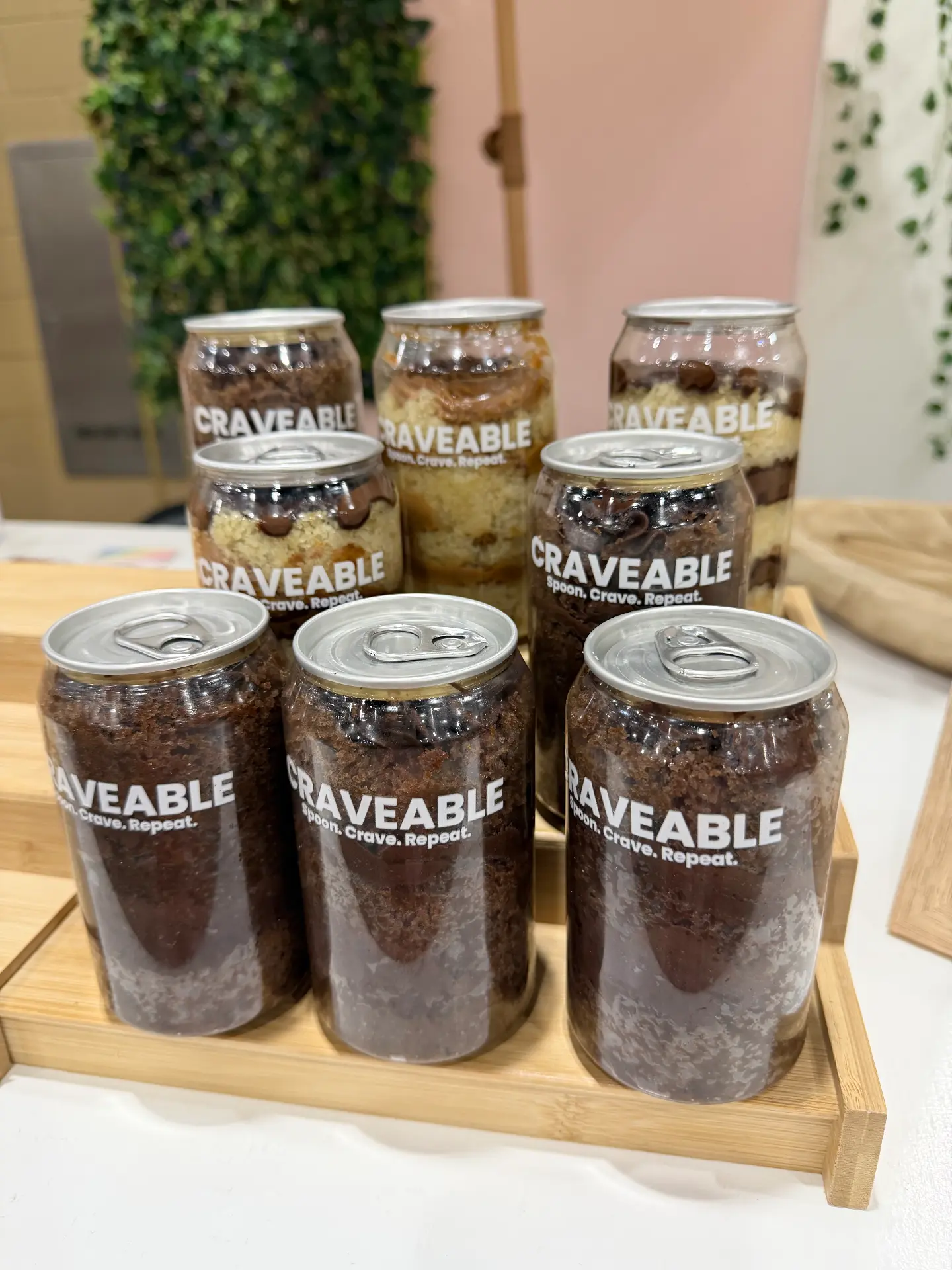 Row of CRAVEABLE cans in assorted flavors