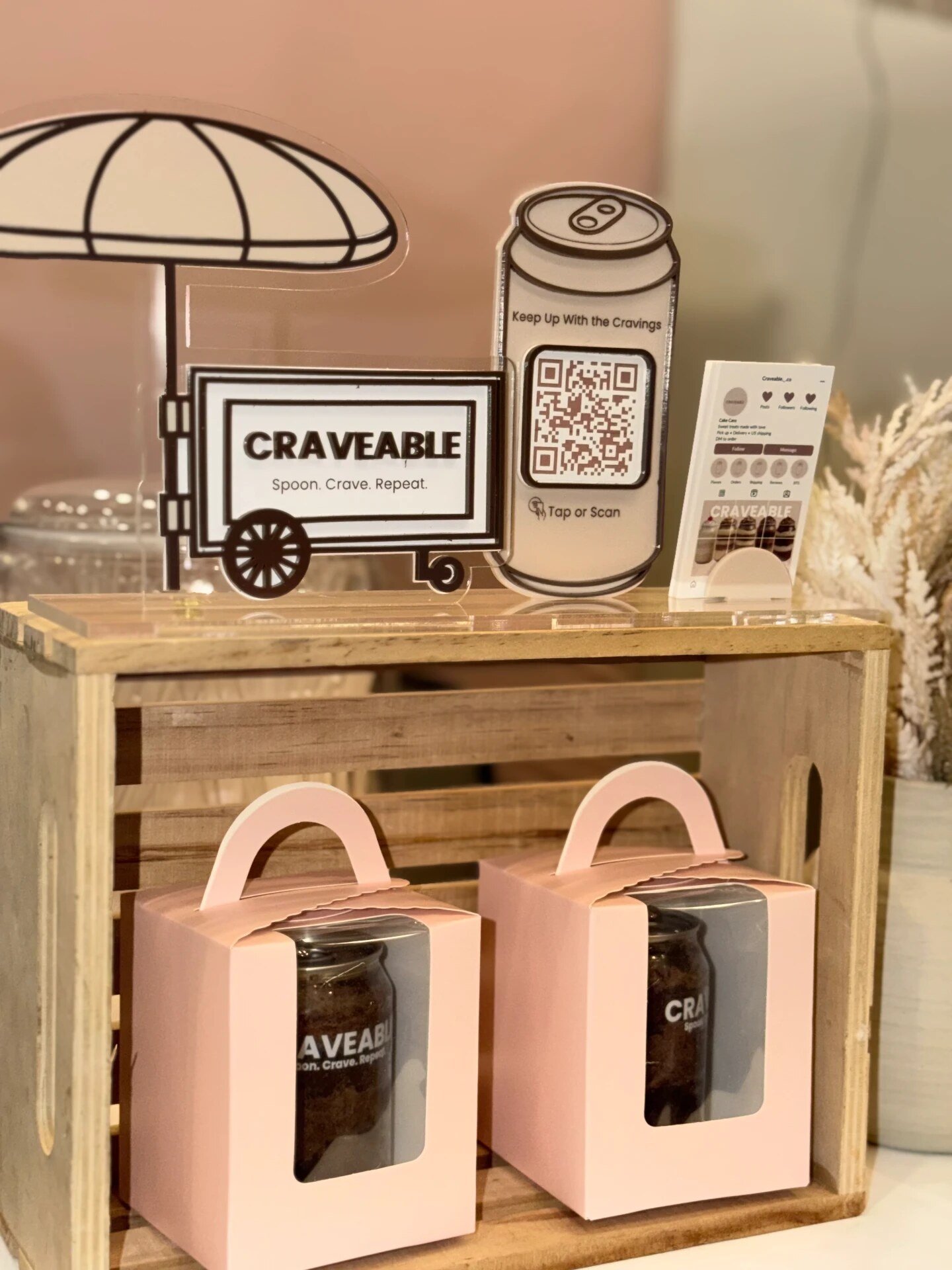 Pink gift boxes styled with CRAVEABLE signage