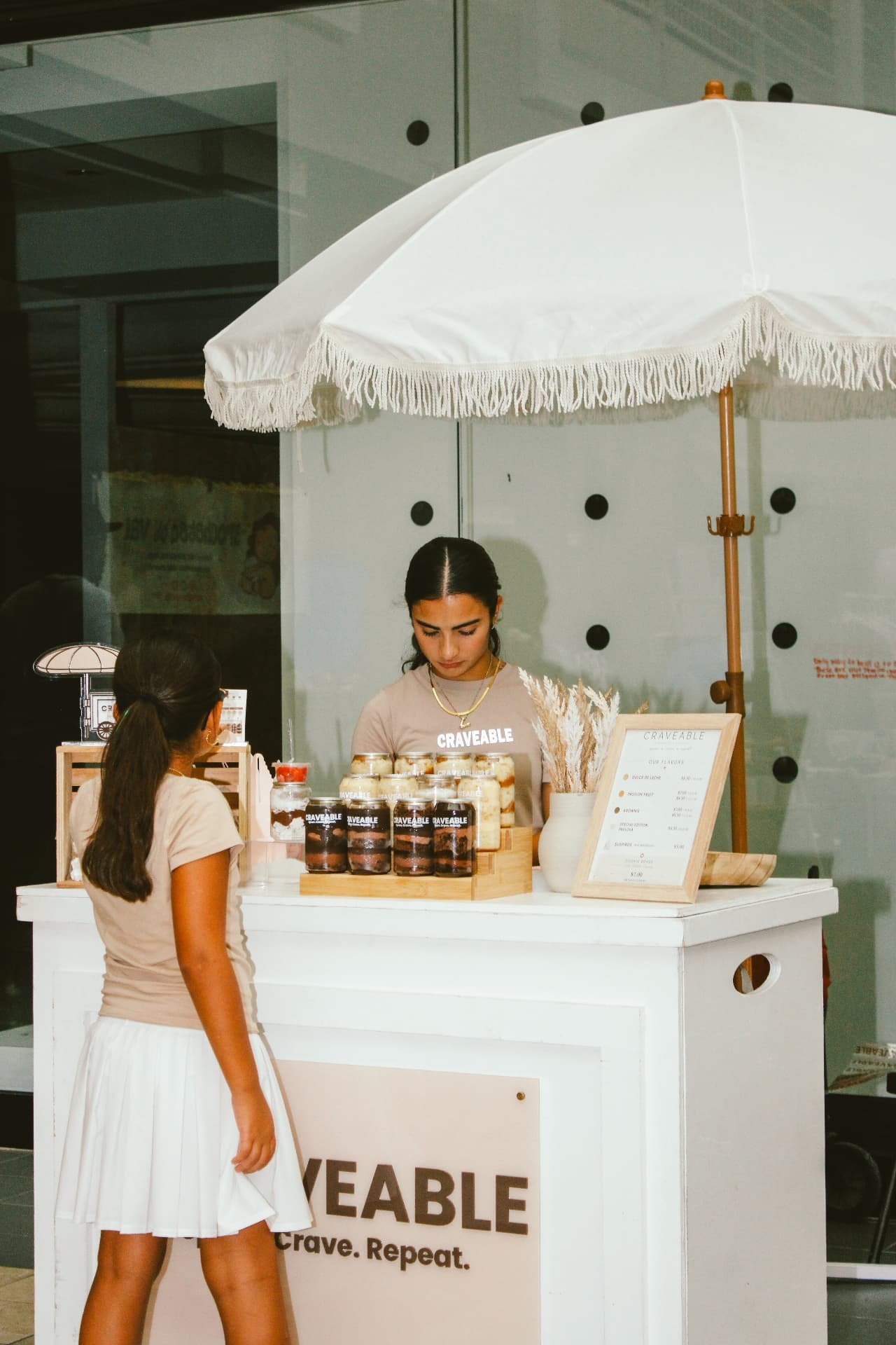 Serving a customer at the CRAVEABLE event cart
